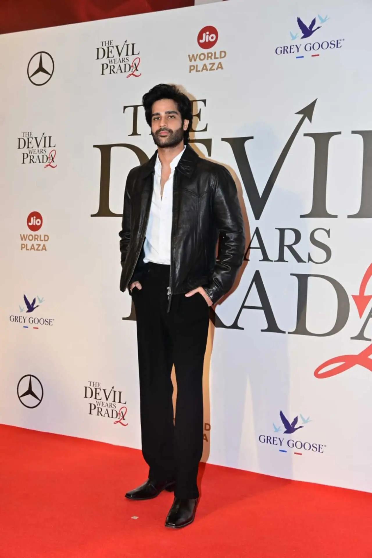 Aaman Devgan sported a black leather jacket over a white shirt and black trousers, completeing the look with formal shoes.